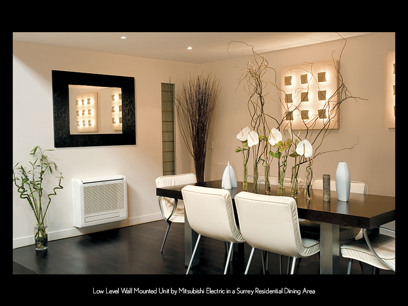 Low Level Wall Mounted Unit by Mitsubishi Electric in a Surrey Residential Dining Area